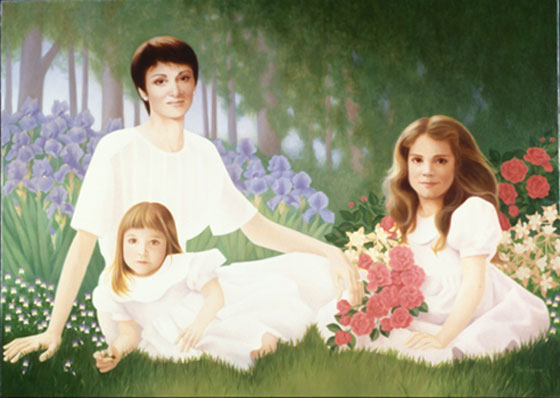 family portrait of mother and two daughters in the garden